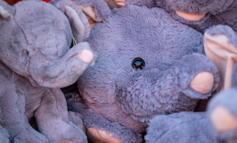 Charming close-up of plush elephant toys showcasing their soft textures and vibrant colors.