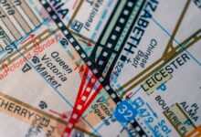 Detailed close-up of Melbourne map highlighting Queen Victoria Market and other landmarks in vivid colors.