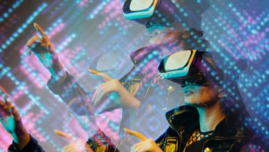 Woman enjoying a virtual reality simulation with futuristic graphics in a dimly lit room.
