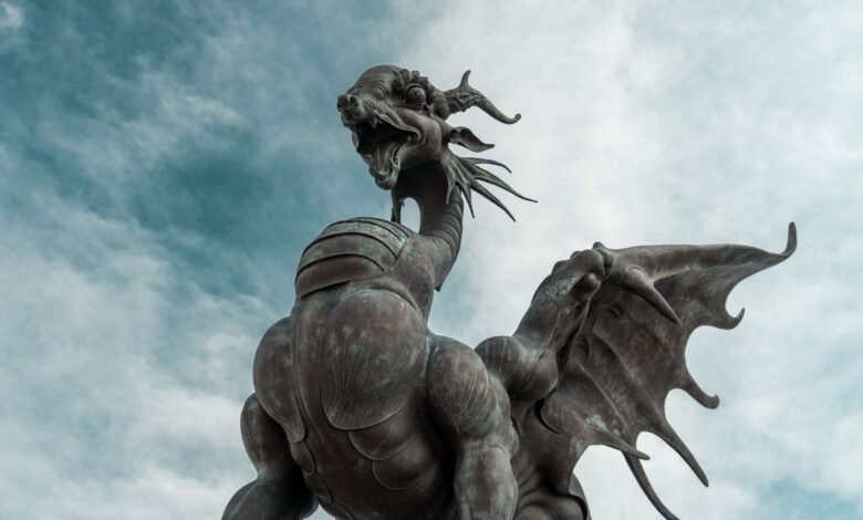Bronze dragon statue with wings and detailed features in Kazan, Russia.