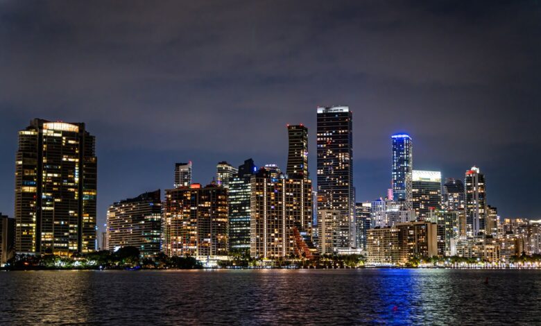 Captivating view of Miami's illuminated skyline at night, showcasing its modern architecture and vibrant city life.