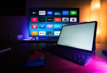 A modern home setup with a smart TV and tablet displaying various streaming apps, highlighting the digital lifestyle.