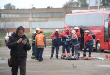 Emergency responders assist at a roadside accident scene in Eleusis, Greece.