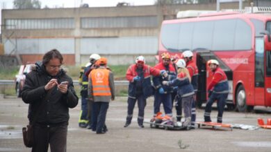 Emergency responders assist at a roadside accident scene in Eleusis, Greece.