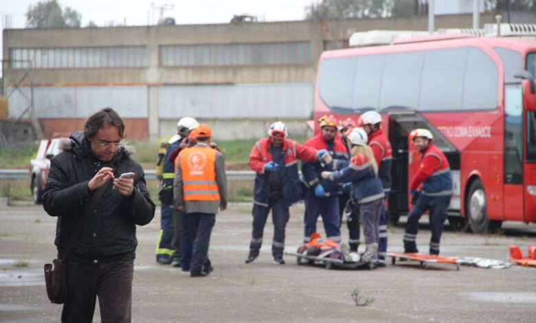 Emergency responders assist at a roadside accident scene in Eleusis, Greece.
