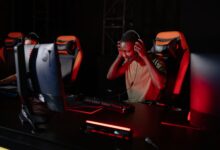 Excited gamer immerses in thrilling video game. Engrossed in a competitive session.