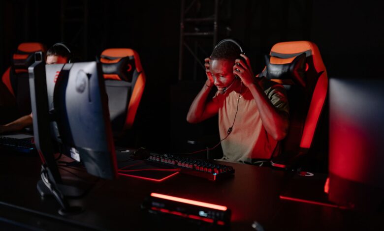 Excited gamer immerses in thrilling video game. Engrossed in a competitive session.