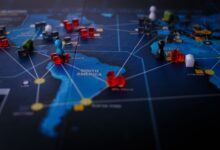 A strategic board game featuring a world map and colorful playing pieces.
