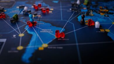 A strategic board game featuring a world map and colorful playing pieces.