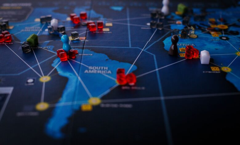 A strategic board game featuring a world map and colorful playing pieces.