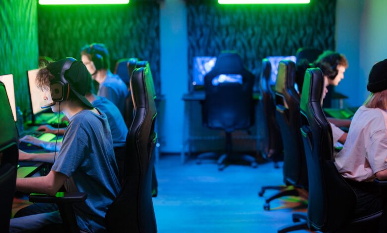 A vibrant gaming scene with a focused esports team immersed in intense gameplay.
