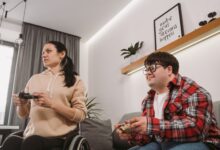 Adults enjoying a fun gaming session indoors, promoting inclusion and diversity.