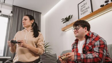 Adults enjoying a fun gaming session indoors, promoting inclusion and diversity.