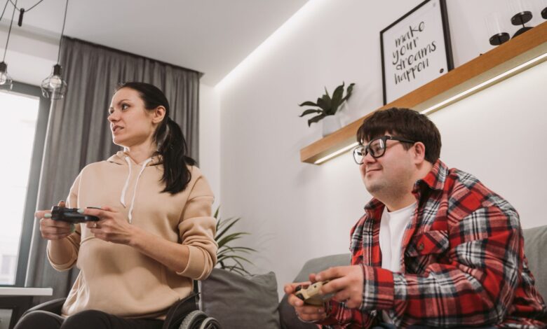 Adults enjoying a fun gaming session indoors, promoting inclusion and diversity.