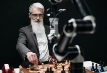 An older man engages in a strategic chess game with a robotic arm, illustrating the blend of tradition and technology.