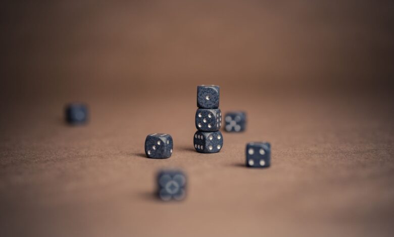 Artistic display of stacked dice showcasing luck and chance in a minimalist composition.