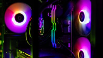Close-up of a custom-built RGB gaming PC showcasing vibrant lighting and high-performance components.