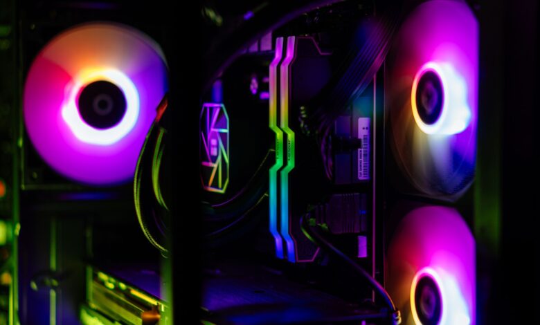 Close-up of a custom-built RGB gaming PC showcasing vibrant lighting and high-performance components.
