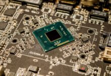 Detailed view of a microchip on a printed circuit board, showcasing electronic components.