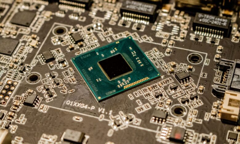 Detailed view of a microchip on a printed circuit board, showcasing electronic components.