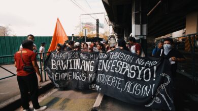 A group of protesters with masks and banner demanding change. Urban protest scene.