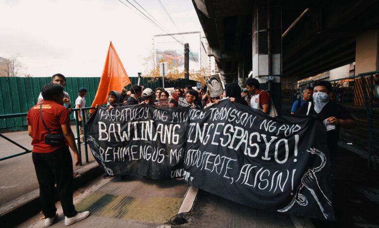 A group of protesters with masks and banner demanding change. Urban protest scene.