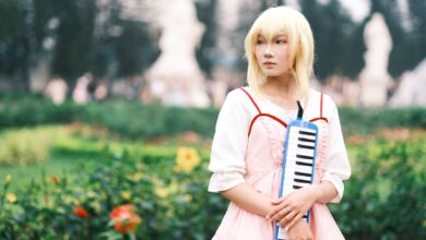 Captivating anime cosplay portrait featuring a person playing a melodica outdoors in Vietnam.