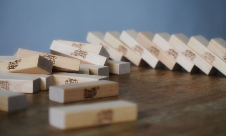 Board game with wooden blocks dropped and scattered on table chaotically after playing