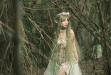 Fantasy-themed portrait of an elf in a bamboo forest, evoking a magical and ethereal atmosphere.
