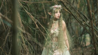Fantasy-themed portrait of an elf in a bamboo forest, evoking a magical and ethereal atmosphere.