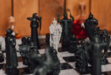 Close-up of medieval-themed chess pieces on a board, creating a strategic atmosphere.