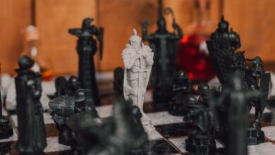 Close-up of medieval-themed chess pieces on a board, creating a strategic atmosphere.
