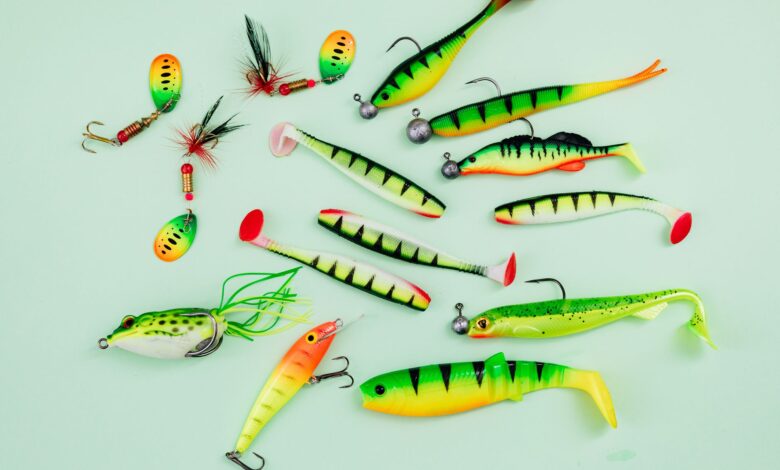 A vibrant collection of fishing lures on a light green surface, ideal for hobbyists.