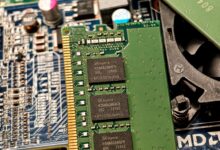 Detailed view of RAM and circuit board components in a computer setup.
