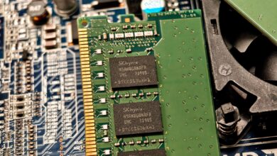 Detailed view of RAM and circuit board components in a computer setup.
