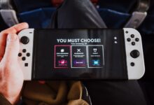 Close-up of a person holding a gaming console with an on-screen decision prompt.