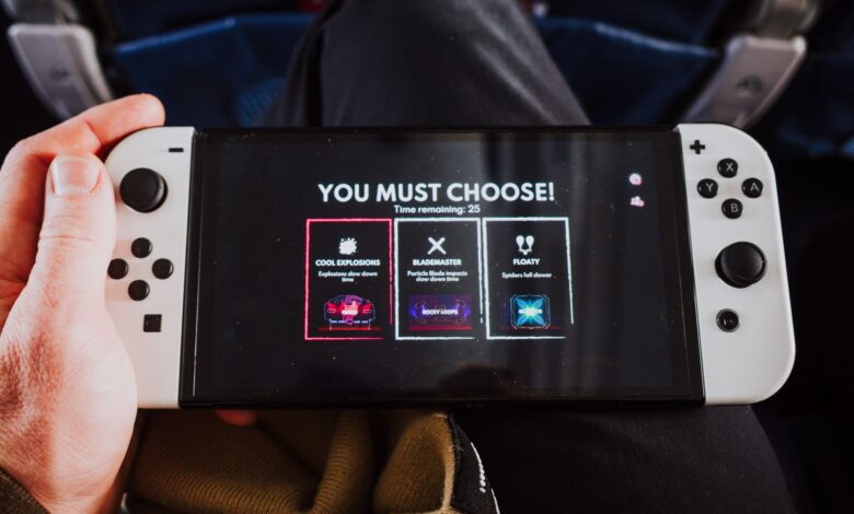 Close-up of a person holding a gaming console with an on-screen decision prompt.