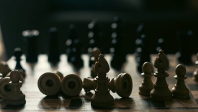 A dramatic representation of strategy and competition with chess pieces on a board.